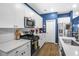 Modern kitchen with white cabinets, gas range and island at 356 Garden Lily Ln, Summerville, SC 29485