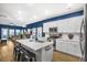 Modern kitchen with white cabinets and an island at 356 Garden Lily Ln, Summerville, SC 29485