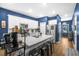 Modern kitchen with white cabinets, island and breakfast bar at 356 Garden Lily Ln, Summerville, SC 29485