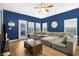 Living room with a large sectional sofa and plenty of natural light at 356 Garden Lily Ln, Summerville, SC 29485