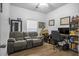 Home office with a comfortable recliner, desk, and bookshelves at 356 Garden Lily Ln, Summerville, SC 29485