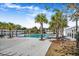 Community pool with palm trees and white pergola at 356 Garden Lily Ln, Summerville, SC 29485