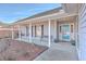 Covered front porch with porch swing, bench, and teal front door at 408 Trailway Dr, Summerville, SC 29483