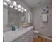 Bathroom with marble countertop and white cabinets at 41 Sorento Blvd, Hanahan, SC 29410