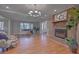 Bright living room with hardwood floors and a brick fireplace at 41 Sorento Blvd, Hanahan, SC 29410