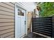 White door and black fence, leads to backyard at 4651 Oakwood Ave, North Charleston, SC 29405