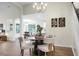 Bright dining room with a round table, four chairs, and hardwood floors at 506 Antebellum Ln, Mount Pleasant, SC 29464