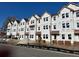 Row of three-story townhomes under construction with red roofs at 5142 Double Eagle Lp, Summerville, SC 29485