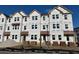 Three story townhome under construction, red roof, and brick accents at 5142 Double Eagle Lp, Summerville, SC 29485