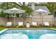 Relaxing pool area with lounge chairs and umbrellas, perfect for summer enjoyment at 523 Reid St, Mount Pleasant, SC 29464