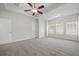 Main bedroom with carpet, ceiling fan, and windows at 593 Crossland Dr, Moncks Corner, SC 29461