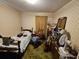 Small bedroom with a twin bed and vintage furniture at 7024 E Constellation Dr, North Charleston, SC 29418