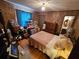 Main bedroom with wood paneling and striped bedding at 7024 E Constellation Dr, North Charleston, SC 29418