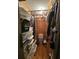 Small bedroom closet with clothes and storage boxes at 7024 E Constellation Dr, North Charleston, SC 29418