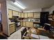 Retro kitchen with beige cabinets and appliances at 7024 E Constellation Dr, North Charleston, SC 29418