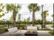 Relaxing outdoor fire pit area with benches and palm trees at 749 Meadowbrook Ln, Summerville, SC 29486