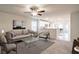 Spacious living room with light beige couch and glass coffee table at 749 Meadowbrook Ln, Summerville, SC 29486