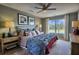 Large bedroom with a king-size bed, window with nature view, and plenty of light at 749 Meadowbrook Ln, Summerville, SC 29486