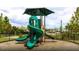 Community playground with a spiral slide and shade structure at 749 Meadowbrook Ln, Summerville, SC 29486