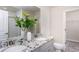 Bathroom with double vanity, granite countertop, and large mirror at 751 Meadowbrook Ln, Summerville, SC 29486