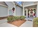 Welcoming front entry with festive holiday wreaths and landscaping at 103 Ivy Terrace Rd, Summerville, SC 29486