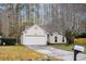 House exterior featuring a two-car garage and landscaped yard at 1111 Alwyn Blvd, Summerville, SC 29485