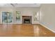 Living room featuring hardwood floors, fireplace and access to a screened porch at 1111 Alwyn Blvd, Summerville, SC 29485