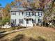 Two-story house with green siding, black shutters, and a landscaped lawn at 12 Monte Sano Dr, Hanahan, SC 29410