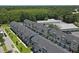 Aerial view of townhouses with gray siding and gray roofs, tree-lined streets, and ample parking at 1243 Allusion Ln # 505, Mount Pleasant, SC 29466