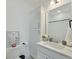 Bathroom with white vanity, linen cabinet, and a toilet at 1243 Allusion Ln # 505, Mount Pleasant, SC 29466