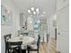 Round dining table with black chairs and view of kitchen at 1243 Allusion Ln # 505, Mount Pleasant, SC 29466