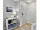 Bright entryway with gray walls, wood-look floors, and a white storage unit at 138 Malibu Rd, Summerville, SC 29483