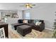 Living room with sectional sofa, ottoman, and view into the kitchen at 138 Malibu Rd, Summerville, SC 29483