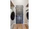 Bright laundry room with washer, dryer, and ample storage at 1581 Harborsun Dr, Charleston, SC 29412