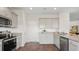 Gray cabinets, granite countertops, and stainless steel appliances in this kitchen at 169 River Hill Rd, Goose Creek, SC 29445