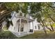 Two story white house with covered patio and side yard at 1992 Groveland Ave, North Charleston, SC 29405