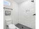 Modern bathroom with white subway tile shower and gray hex floor at 1994 Groveland Ave, North Charleston, SC 29405