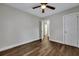 Spacious bedroom with hardwood floors, ceiling fan, and access to bathroom at 2265 Bailey Dr, North Charleston, SC 29405