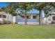 Charming blue house with a covered porch and large trees at 2265 Bailey Dr, North Charleston, SC 29405