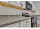 Renovated kitchen featuring granite countertops and stainless steel appliances at 2265 Bailey Dr, North Charleston, SC 29405