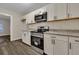 Updated kitchen with white cabinets, granite countertops, and stainless steel range at 2265 Bailey Dr, North Charleston, SC 29405