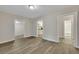 Open living area with wood-look floors and access to kitchen and bathroom at 2265 Bailey Dr, North Charleston, SC 29405
