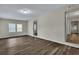 Bright living room with hardwood floors and access to other rooms at 2265 Bailey Dr, North Charleston, SC 29405