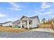 Charming house exterior with covered porch and gravel driveway at 255 S Railroad Avenue, Ridgeville, SC 29472