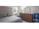 Bedroom with gray bedding, a dresser, and two accent chairs at 304 Tiliwa Street, Summerville, SC 29486