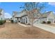 Gray house with driveway and landscaping at 311 Bloomington Way, Summerville, SC 29486