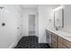 Bathroom with double vanity, hexagon floor tile, and walk-in shower at 318 Abercom Place Dr, Moncks Corner, SC 29461
