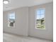 Spacious bedroom with two windows offering ample natural light at 318 Abercom Place Dr, Moncks Corner, SC 29461
