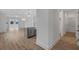 Modern kitchen with island, stainless steel appliances, and hardwood floors at 318 Abercom Place Dr, Moncks Corner, SC 29461