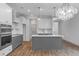 Modern kitchen with gray cabinets, quartz countertops, and stainless steel appliances at 318 Abercom Place Dr, Moncks Corner, SC 29461